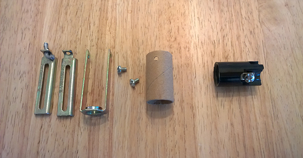 Candelabra socket disassembled. We only need the socket itself, shown on the right.