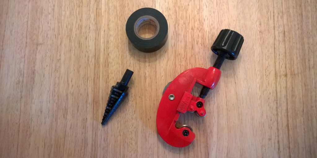 A few required tools, a stepped drill bit (for drilling the mounting holes in the fixture plate), a copper pipe cutting tool and a roll of electrical tape.