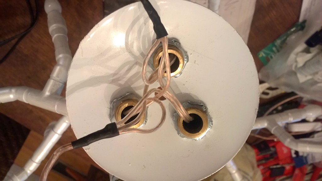 Here you can see the threaded brass adapters and electrical bushing nuts securing the fixture horns to the metal dome fixture plate. Be sure to get brass threaded adapters and not copper, copper threads are too soft to tighten properly and will bind.